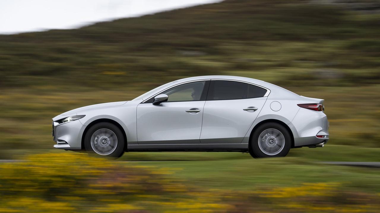 Mazda 3 saloon in silver, side shot