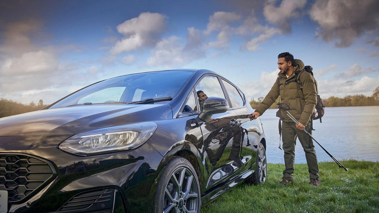 Man getting into Ford Fiesta