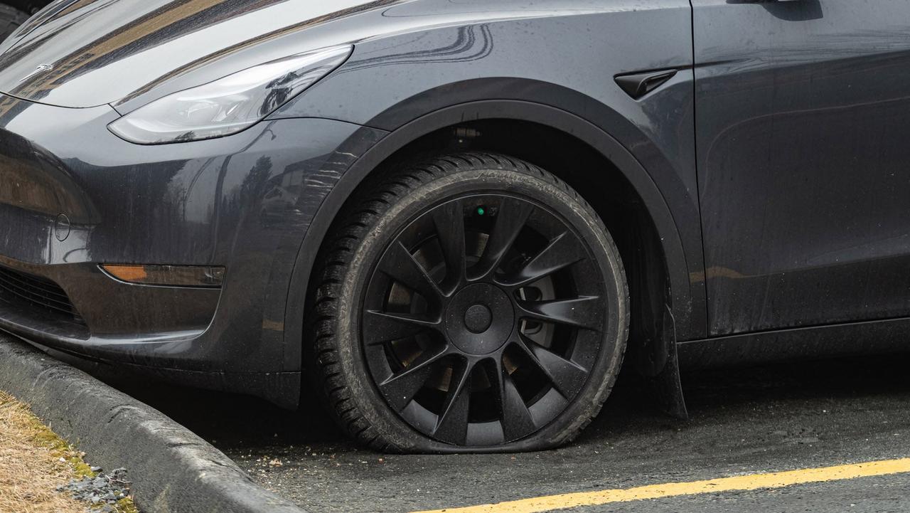 Tesla with flat tyre