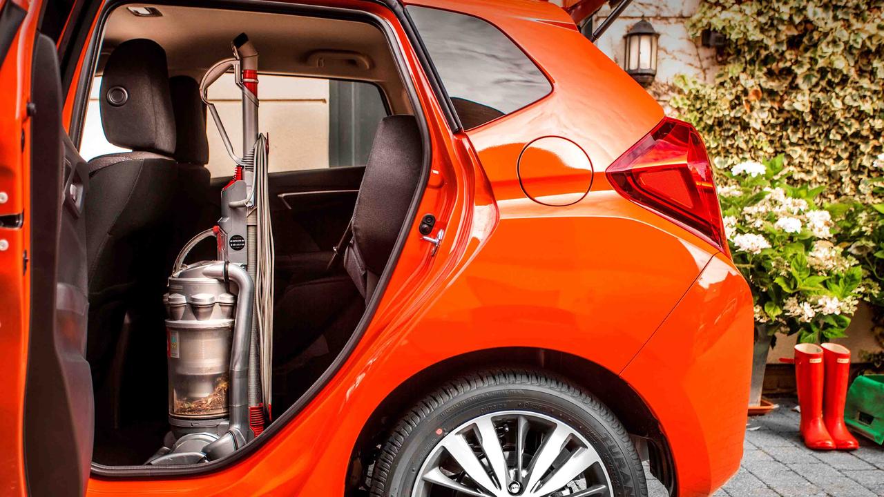 Honda Jazz with vacuum cleaner in rear seat