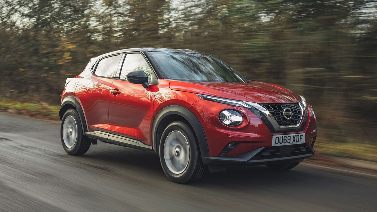 Red Nissan Juke driving