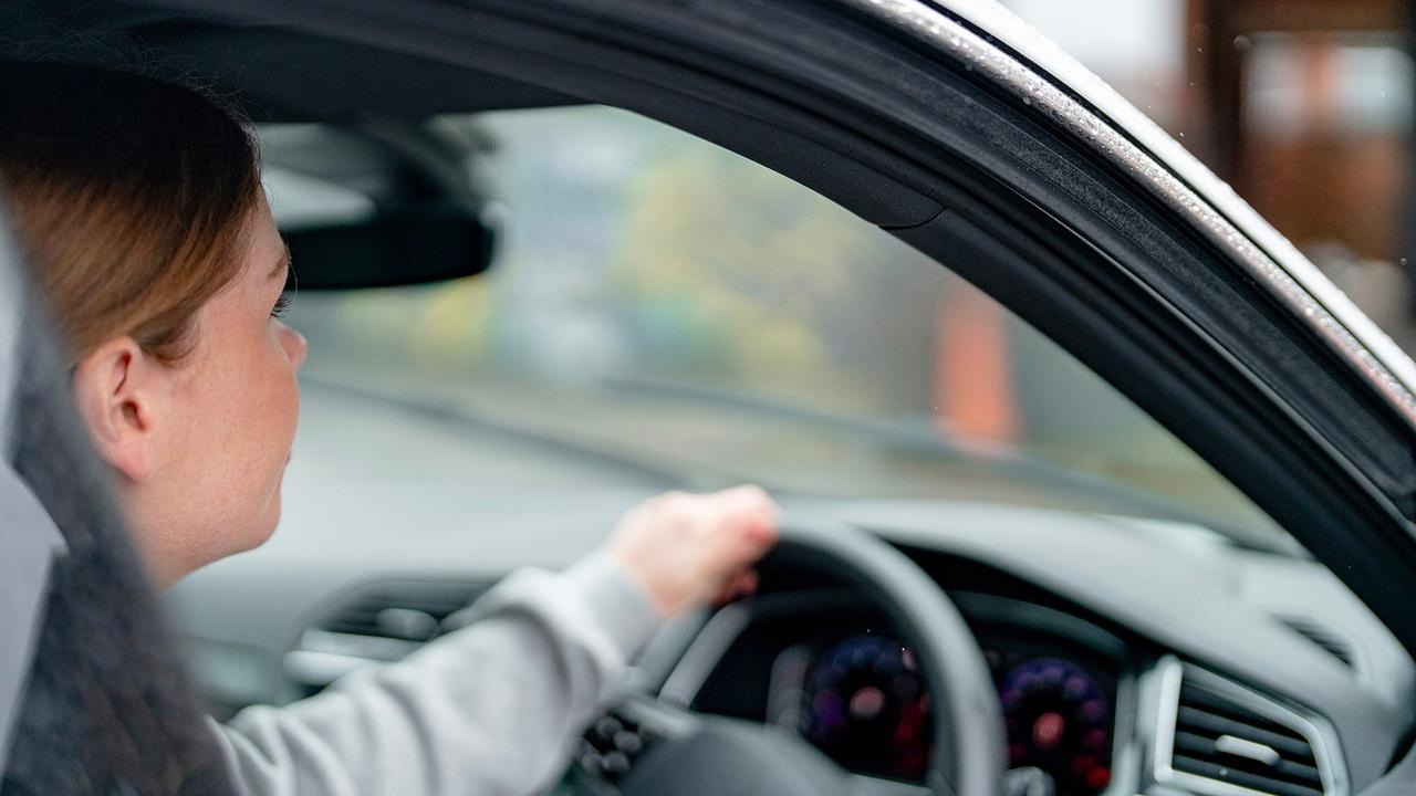 Over shoulder shot of car driver