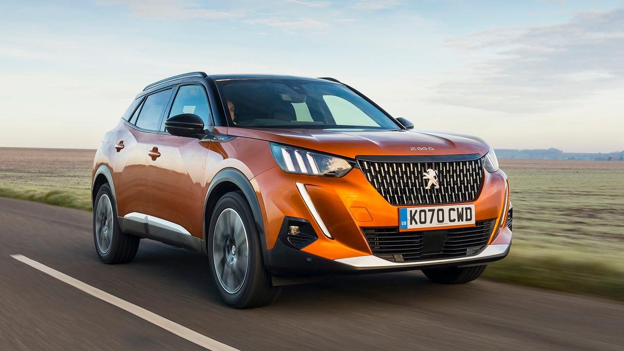 Orange Peugeot 2008 driving