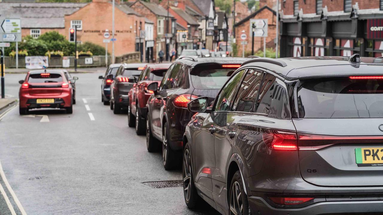 Cars queuing at a traffic light