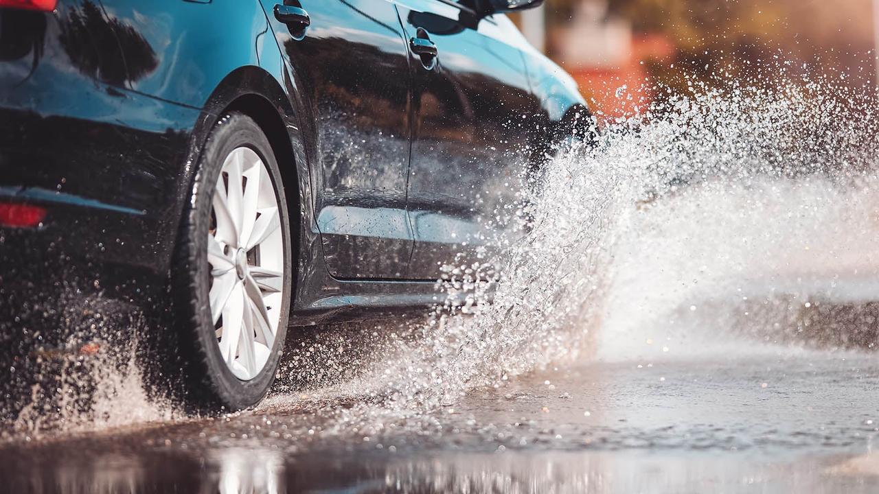 Car splashing through puddle
