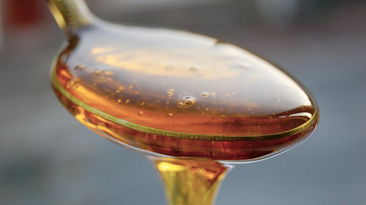 Closeup of honey in a spoon