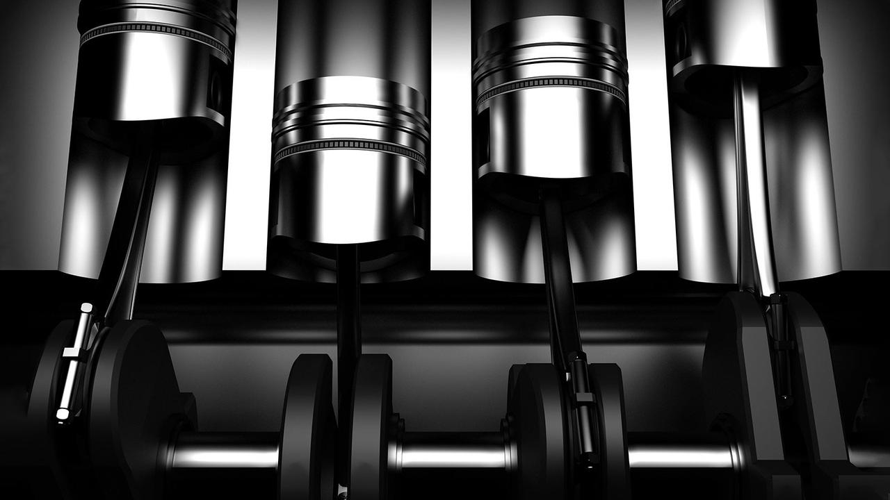 Pistons in car engine cutaway