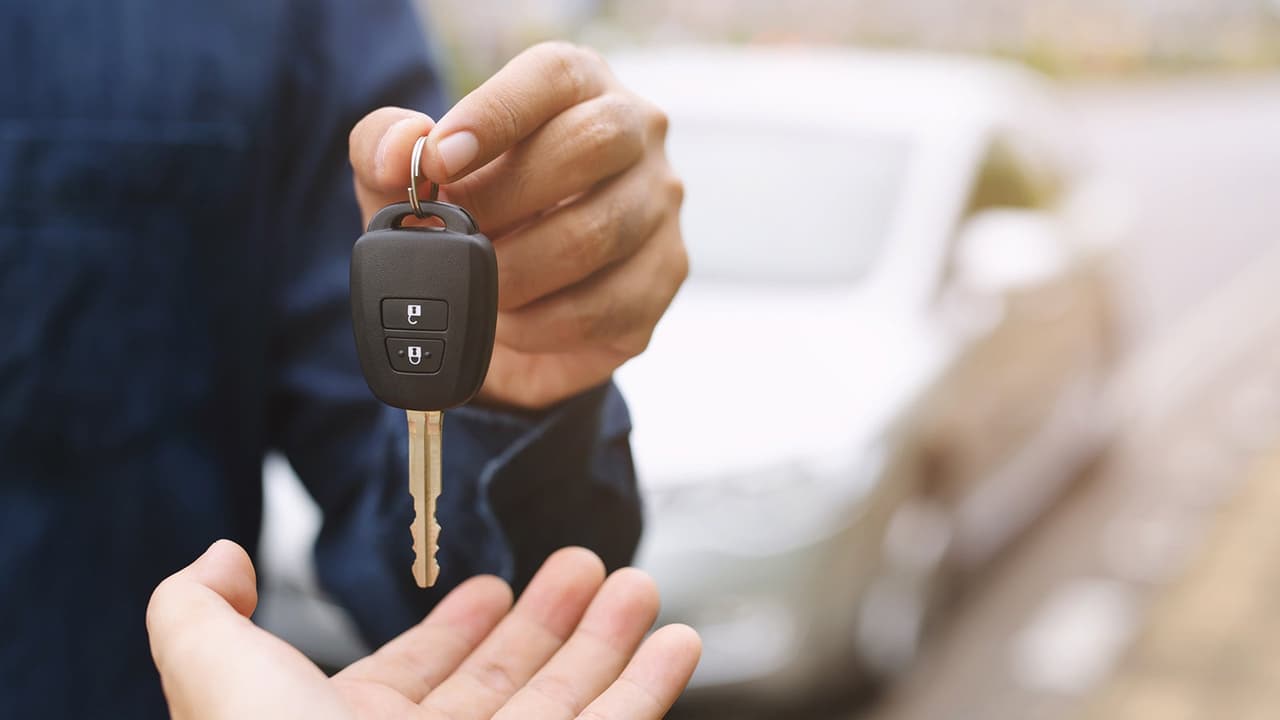 Person handing car keys over