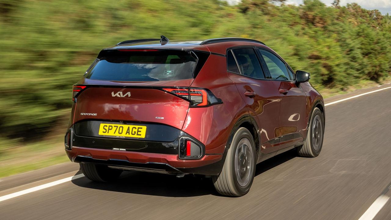 Kia Sportage in red, rear three quarter