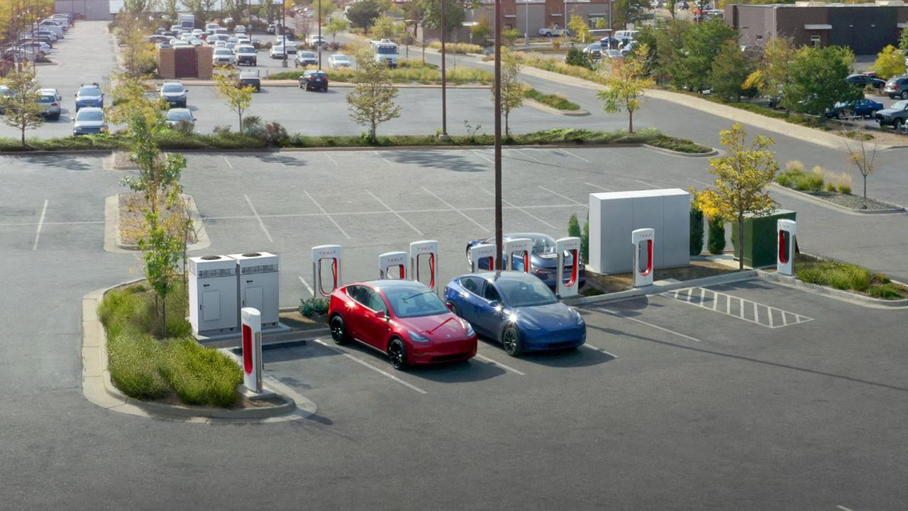 Two Teslas charging in the distance