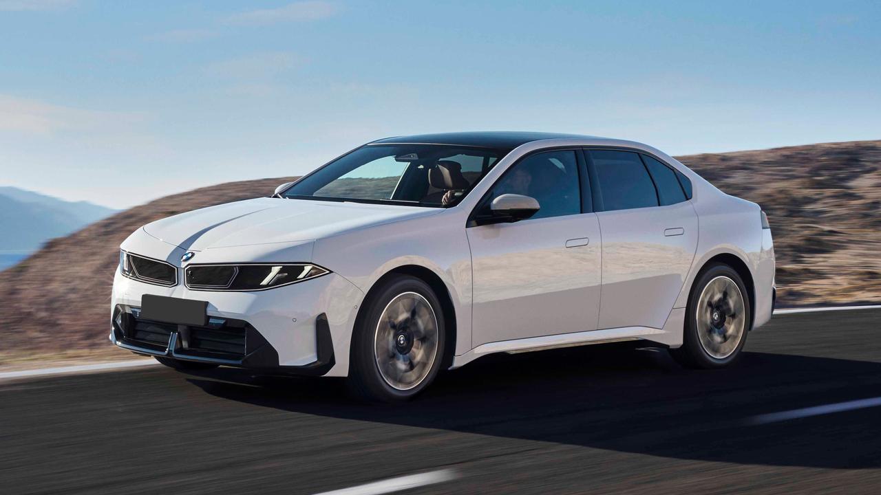 White BMW i3 saloon driving