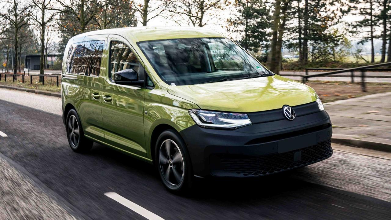 Green VW Caddy driving