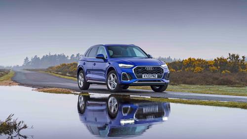 Audi Q5 parked next to puddle
