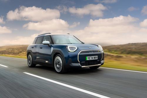 Mini Aceman blue front three quarters driving facing right